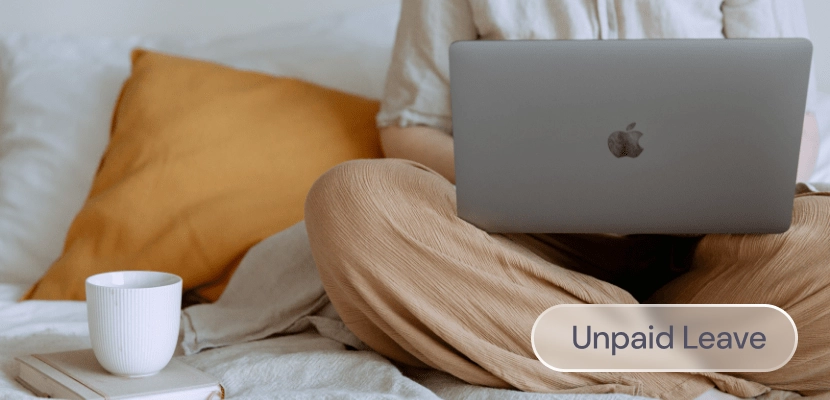 Someone working on a laptop while on a sofa