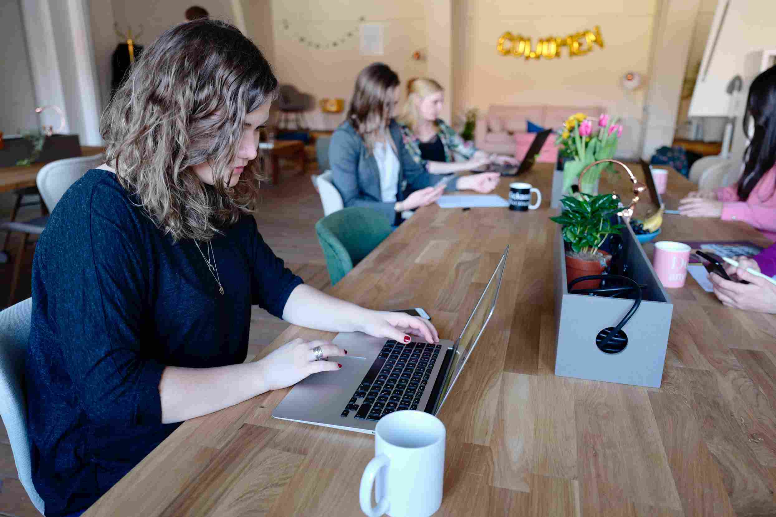 staff members in a meeting room calculating labour turnover