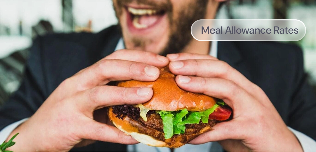 A man eating a burger, with the label: Meal Allowance Rates