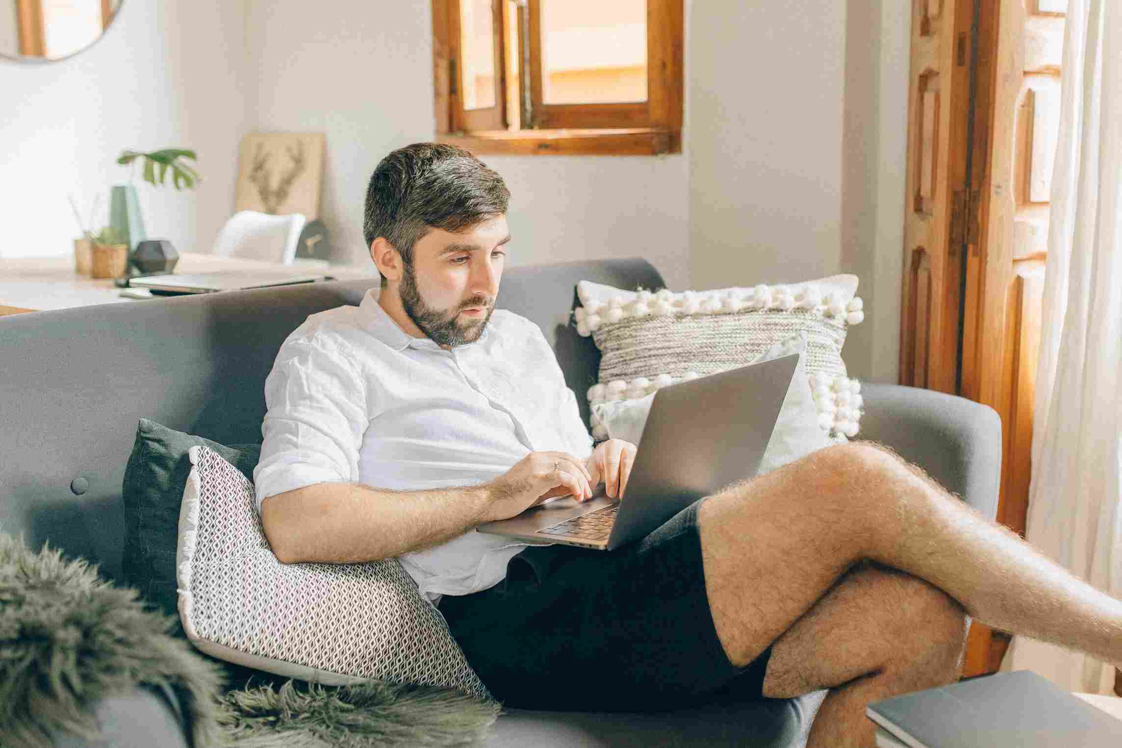man choosing to work from home and working a hybrid schedule