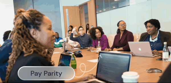 A group of women at an office meeting table