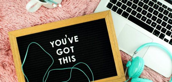 A laptop and blackboard, which reads: You've got this